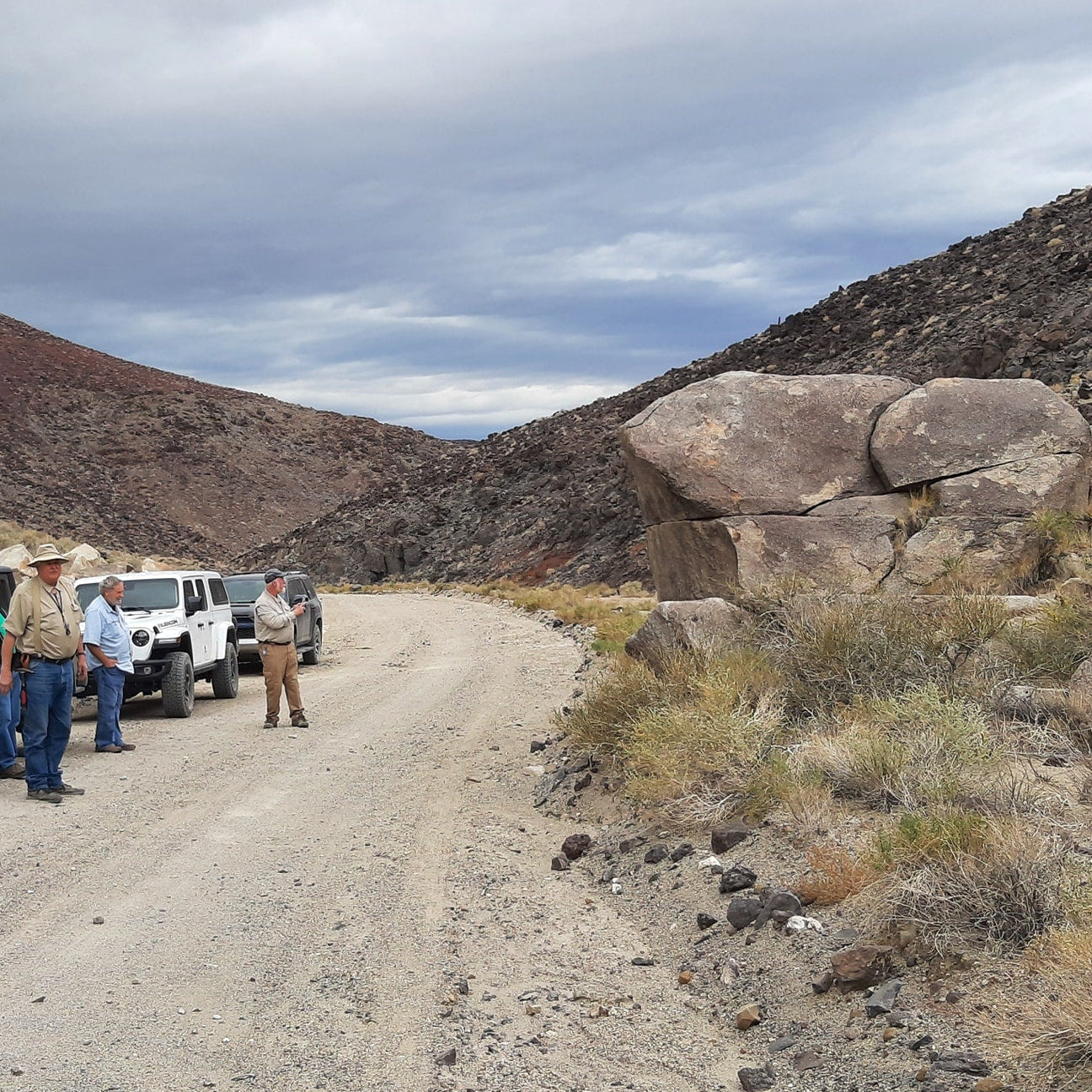 Roseville Rock Rollers standing on a dirt road in a desert landscape of Hawthorne Nevada.